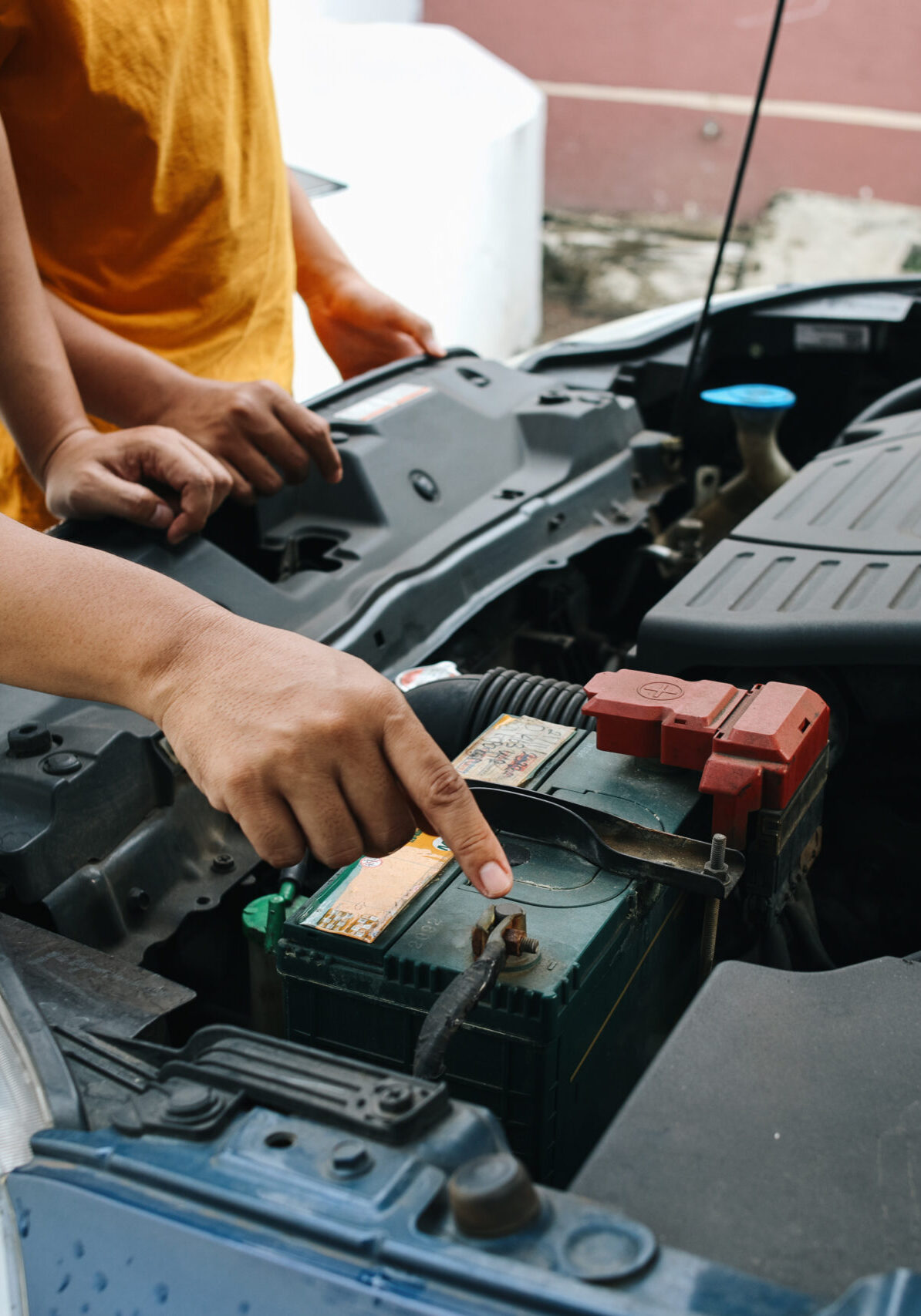 men-checking-car-engine-at-garage-workplace-2026-03-24-13-04-52-utc